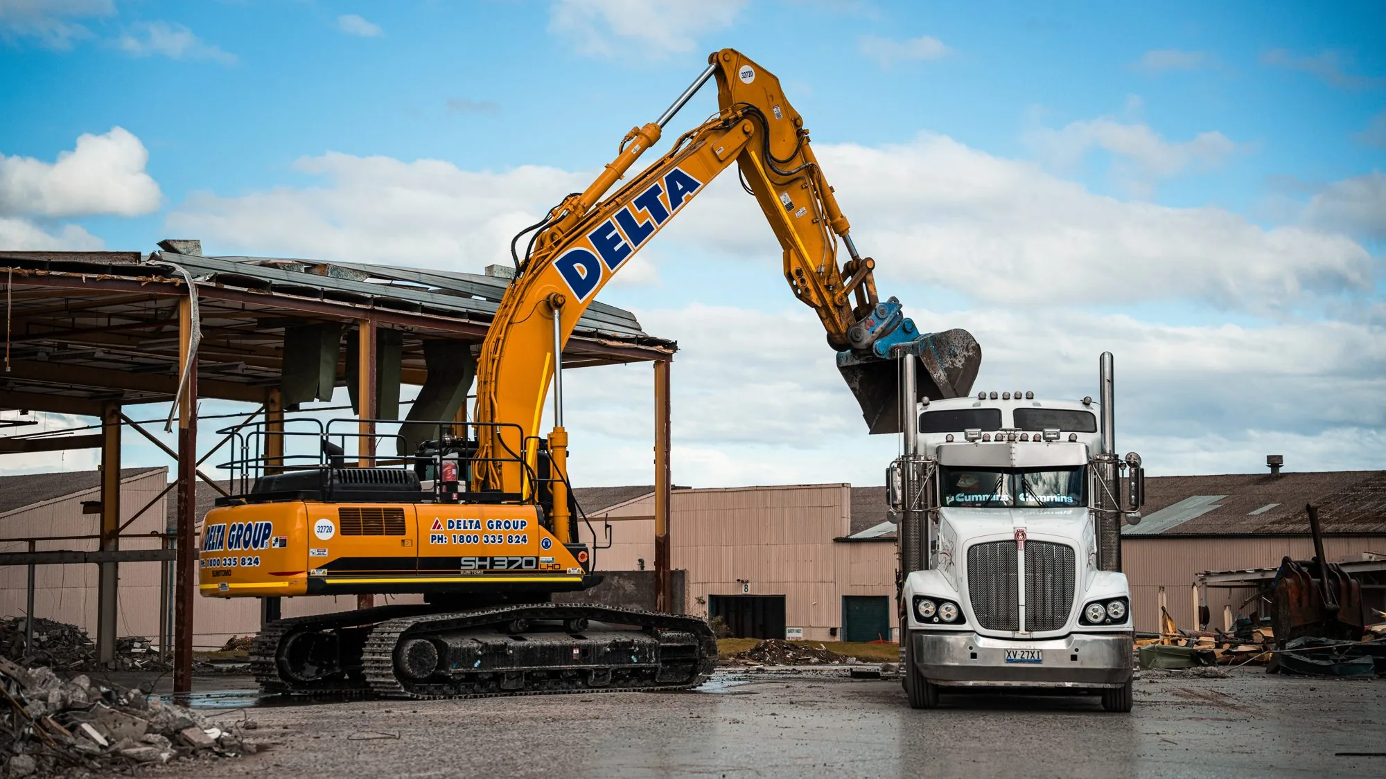 Excavator loading a truck on a Melbourne site