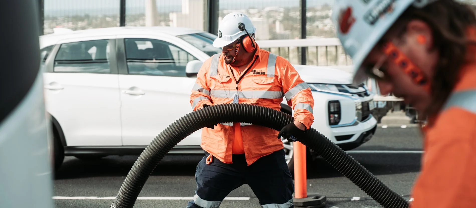 QEST worker with industrial vacuum on the West Gate Bridge